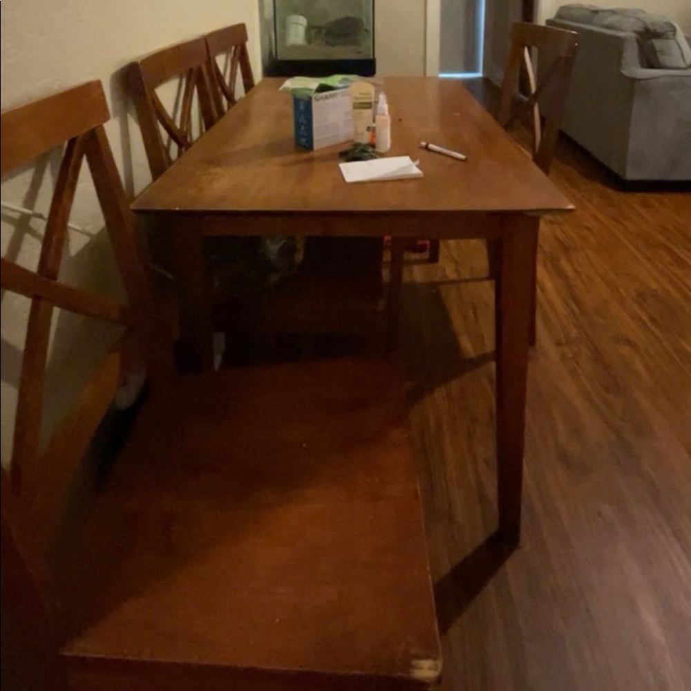 Used table and all four chairs. Not shaky. Does have some wear but still good.